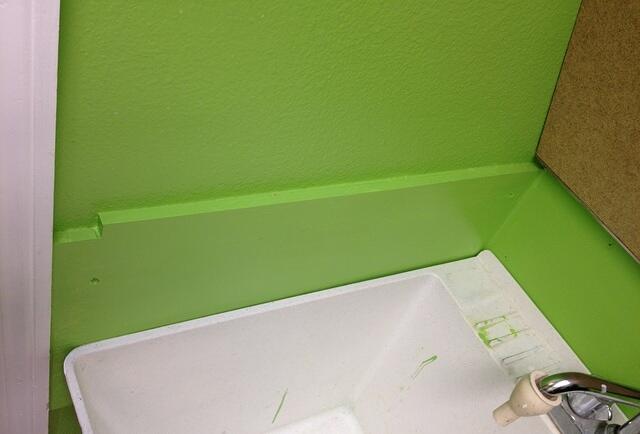 Laundry folding countertop hinges open to reveal utility sink 5