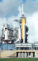 09-SpaceShuttleOnLaunchPadWithPayloadCanister
