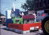 Kurt and Tina Leucht on Methodist Church float, Log Cabins to Steeples